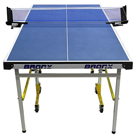 Image of Bronx Mini Table Tennis Table with 18 mm Both Side Laminated Blue top and 50 mm Wheel (2 TT bat, 3 Balls and 1 Cover)